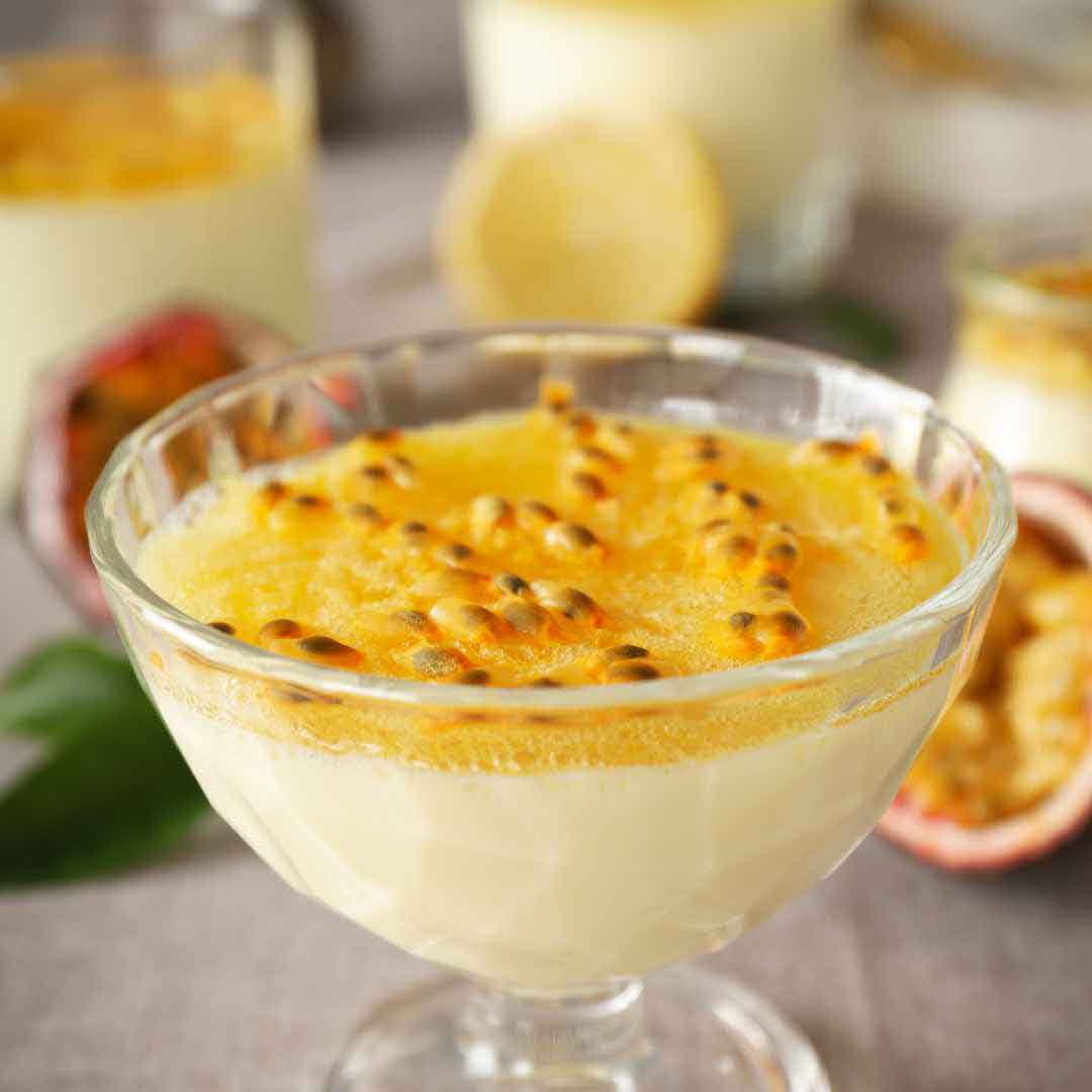 "Homemade honey passion fruit whipped cream in a bowl", "Fluffy whipped cream infused with passion fruit and natural honey", "Delicious tropical whipped cream topping for desserts", "Freshly made whipped cream with pure honey and passion fruit", "Sweet and tangy honey passion fruit whipped cream ready to serve"
