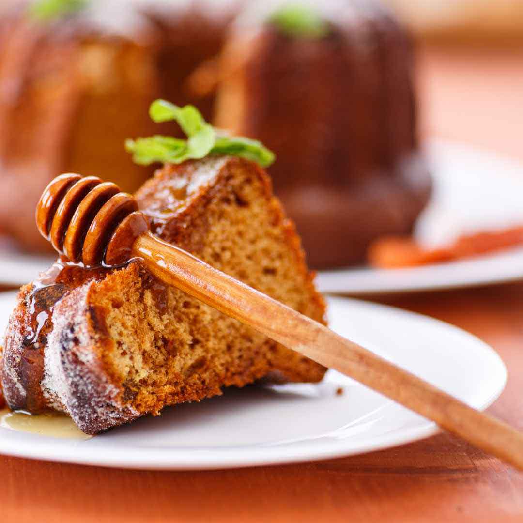 Traditional lekach honey cake with spices Moist and flavorful Jewish honey cake Homemade spiced honey cake for Rosh Hashanah Classic lekach dessert made with natural honey Authentic Jewish honey cake with a golden crust