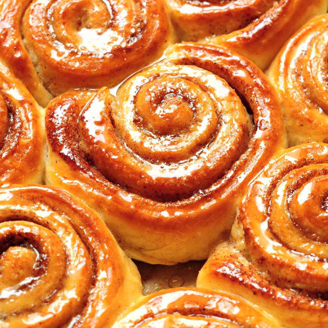 "Homemade honey buns with cinnamon filling", "Soft and fluffy honey-infused buns", "Delicious honey-glazed sweet rolls", "Freshly baked honey buns with a golden crust", "Sweet and sticky honey breakfast buns"