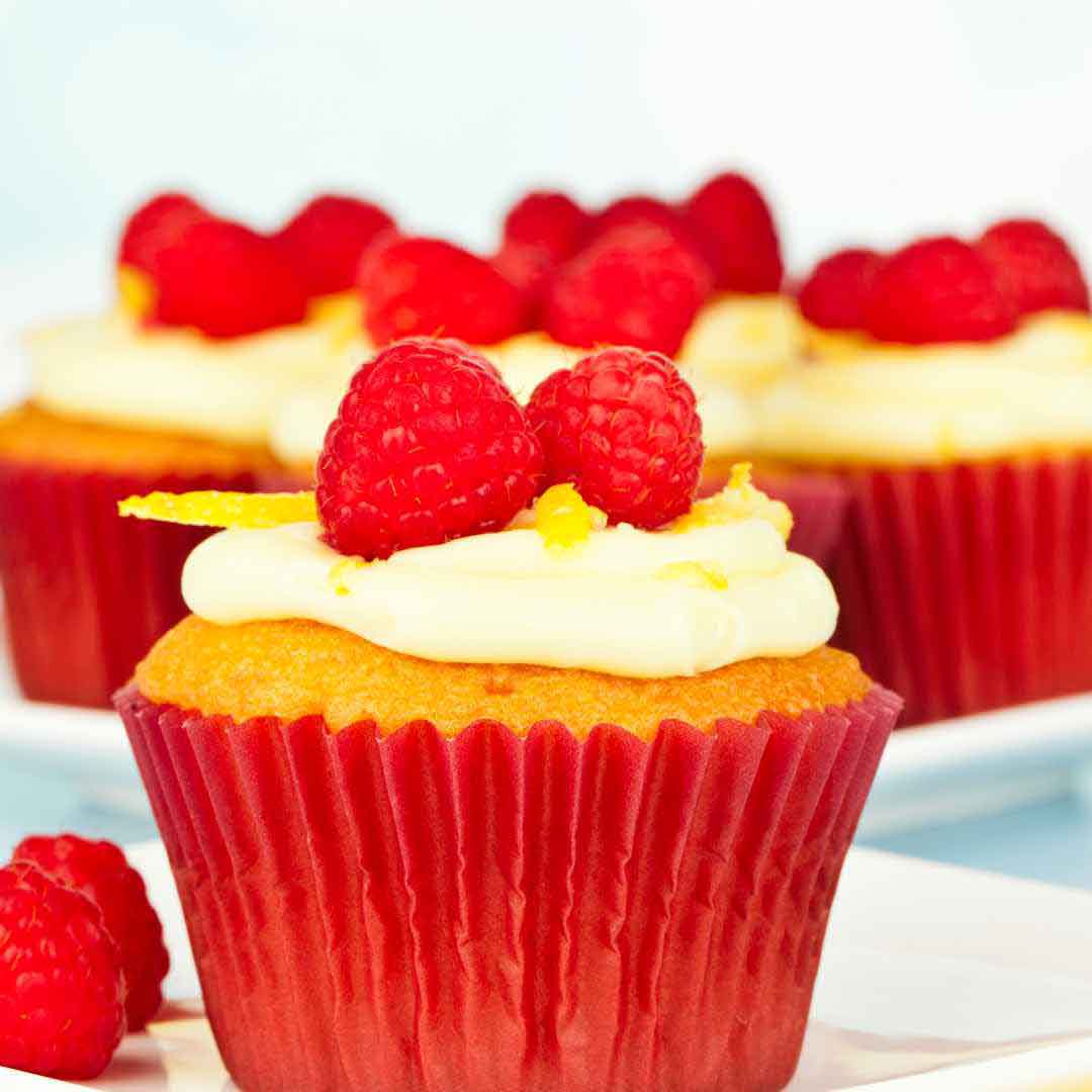 Delicious Meyer lemon and raspberry cupcakes naturally sweetened with honey for a fresh, flavorful treat Homemade lemon raspberry cupcakes made with natural honey for a healthier and tastier dessert Tasty honey-infused lemon raspberry cupcakes offering a sweet and tangy flavor in every bite Sweet and tangy lemon raspberry cupcakes made with honey for a delicious, refreshing treat Freshly baked Meyer lemon and raspberry cupcakes sweetened with honey, offering a delightful combination of flavors
