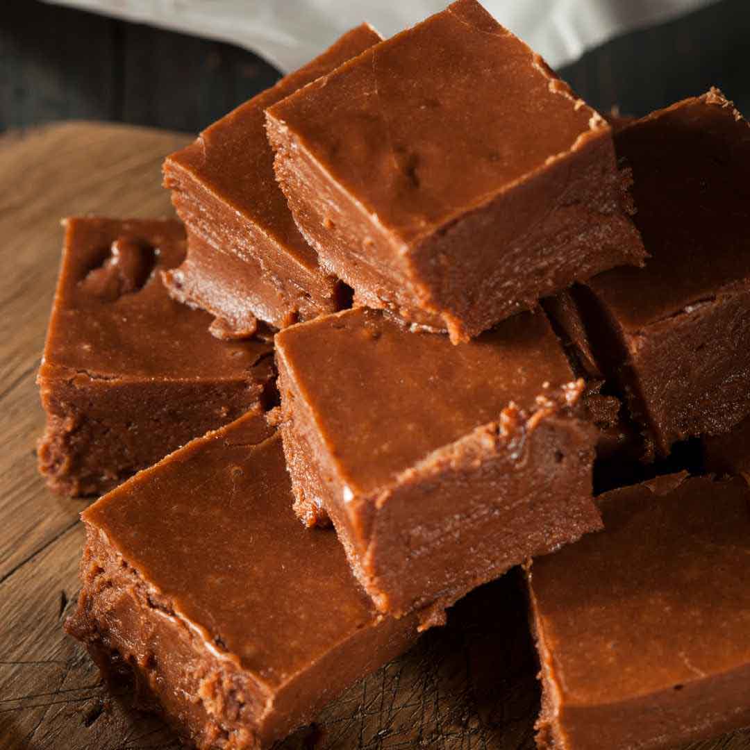 Squares of old fashioned honey fudge on a plate Creamy homemade fudge made with natural honey Buttery honey-infused fudge pieces ready to serve Traditional honey fudge with chopped nuts Delicious honey chocolate fudge squares