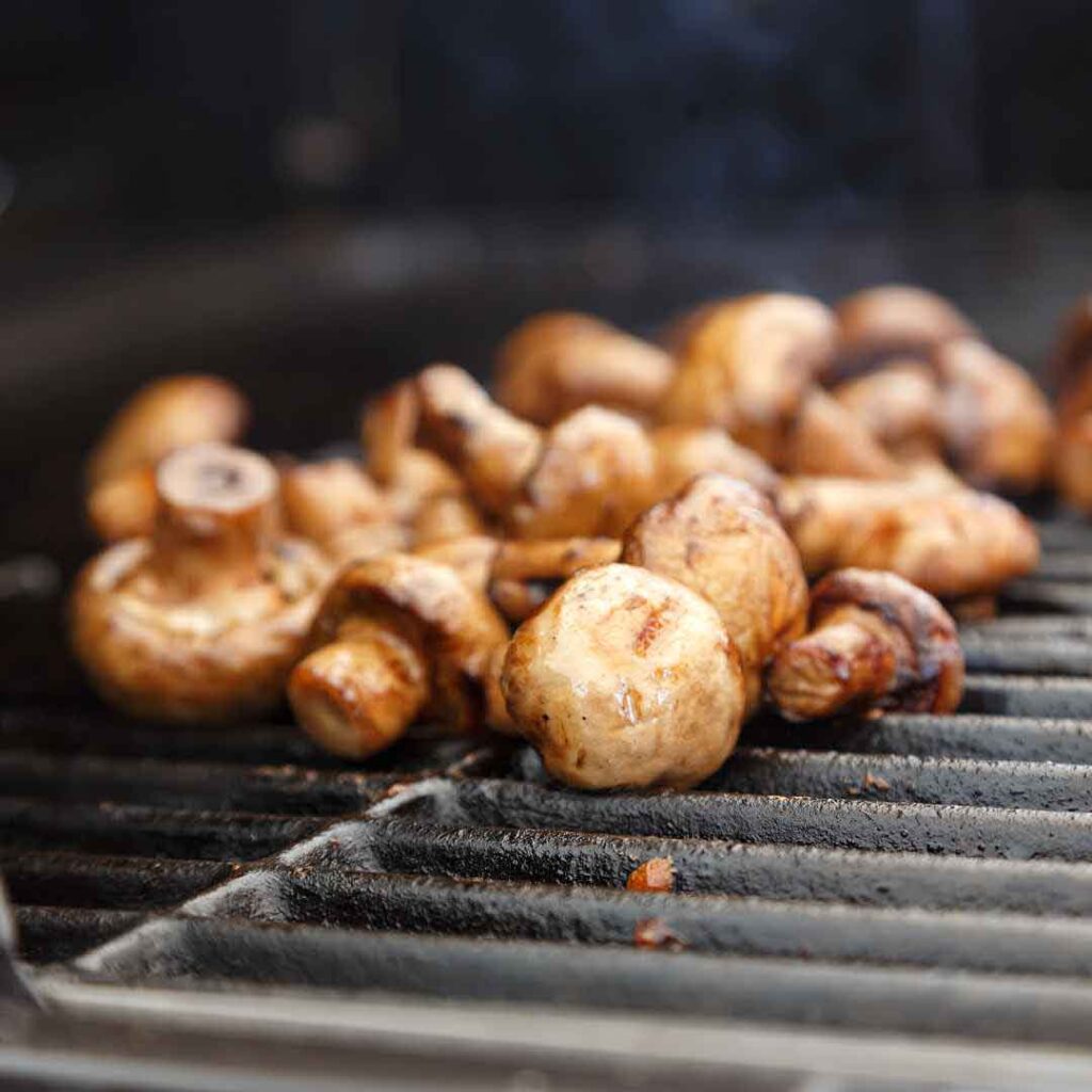 Sweet and hot marinated mushrooms glazed with honey Honey soy marinated mushrooms with sesame and ginger Spicy honey glazed button mushrooms served as a side dish Marinated mushrooms featuring natural honey and spices Gourmet sweet and spicy mushrooms prepared with organic honey