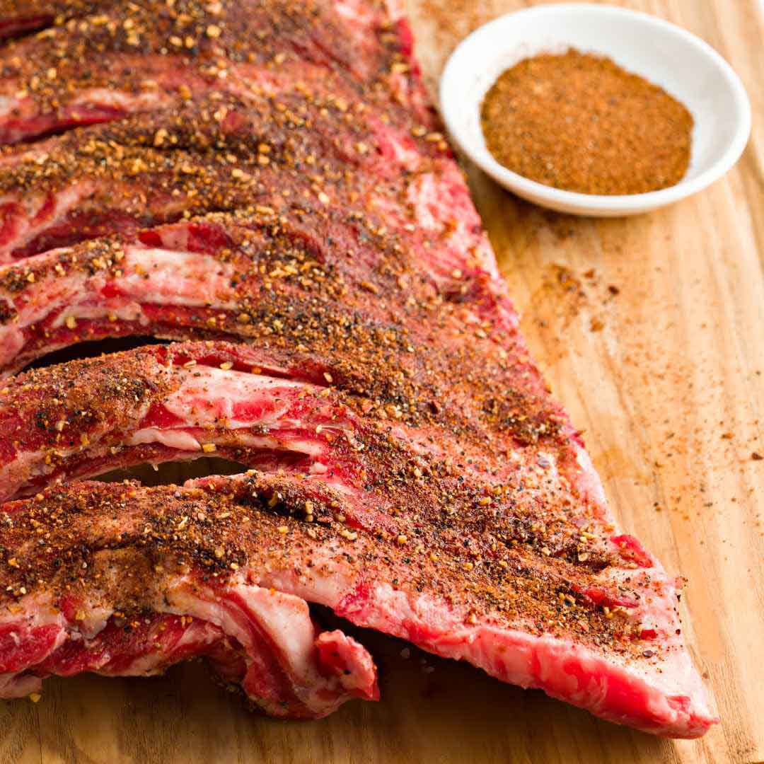 Homemade pork rub ingredients including honey and spices Sweet and spicy honey pork rub in a bowl Dry rub for pork featuring natural honey and seasonings Honey-infused BBQ rub applied to pork shoulder Spice blend with honey for seasoning pork dishes